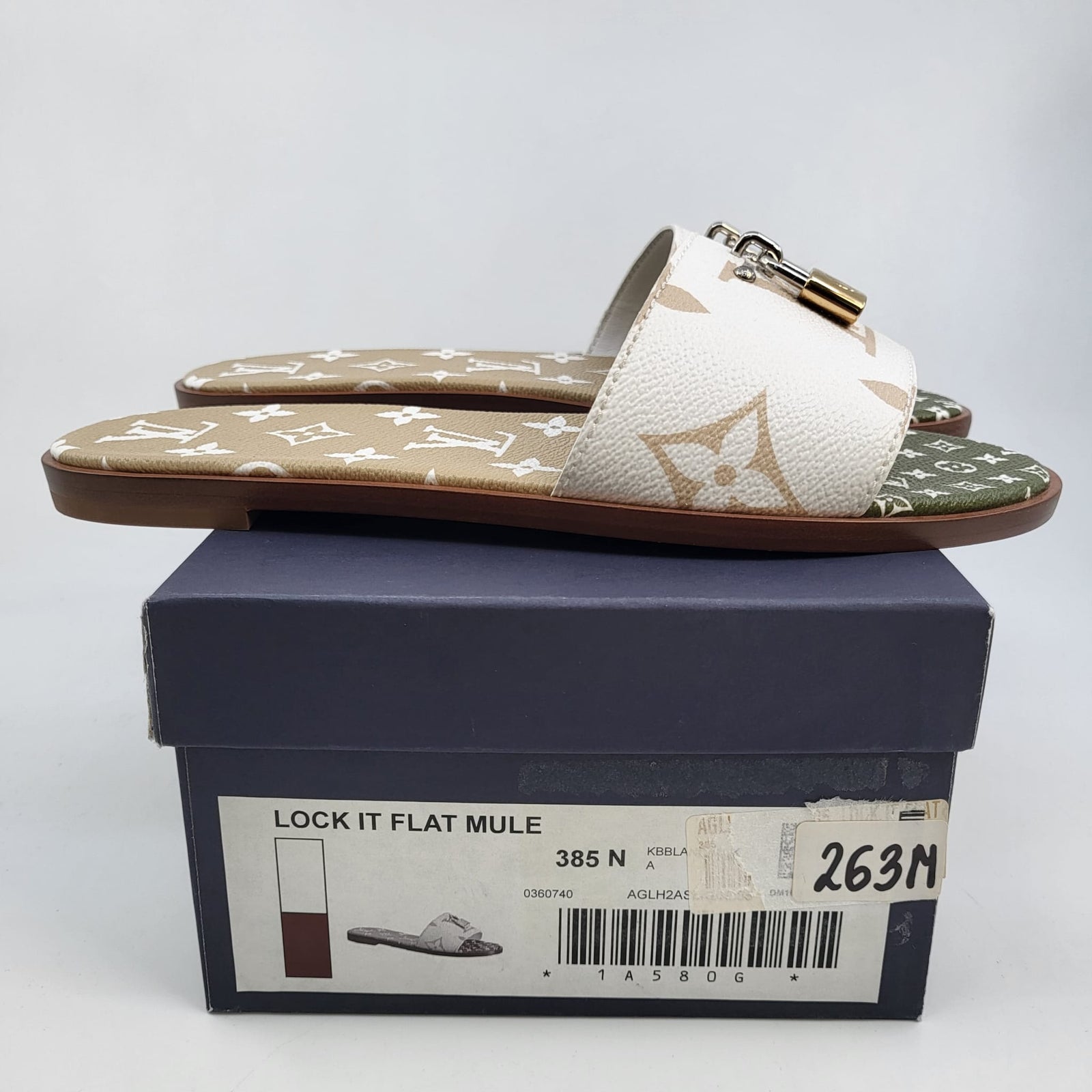 Louis Vuitton Women's Monogram Canvas Lock It Flat Mule – Luxuria