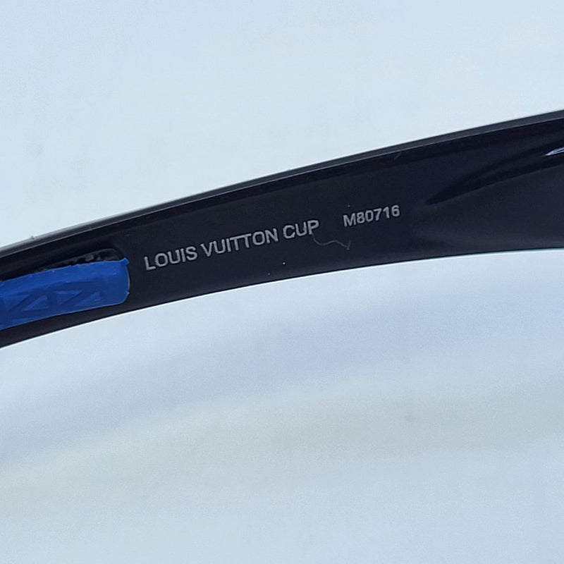Is this blue Louis Vuitton ribbon fake? The fonts are white when